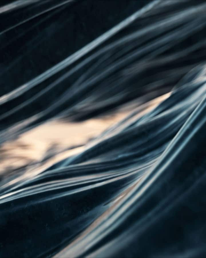 Macro photograph of underwater ocean wave texture.